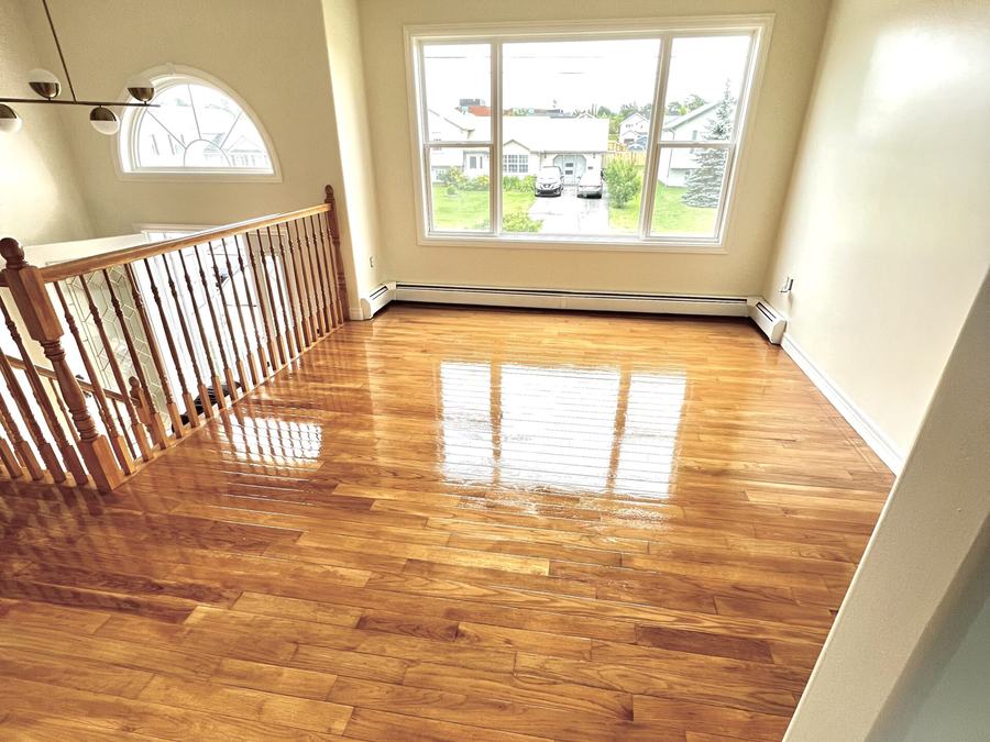 Glossy finished hardwood floor in an open living area