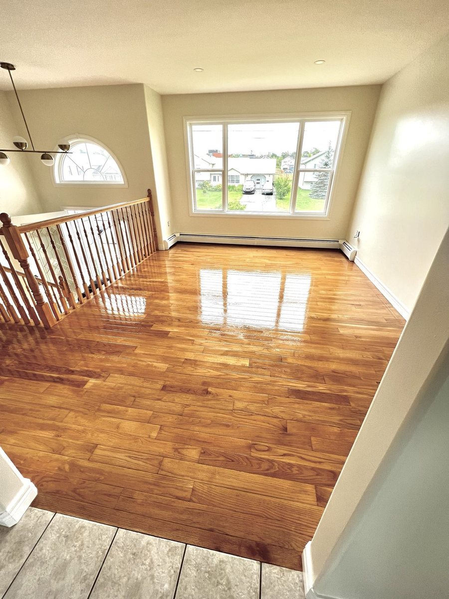 A hardwood floor finished by High-5 Renovations