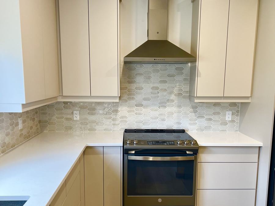 Finished a tile backsplash by High-5 Renovations