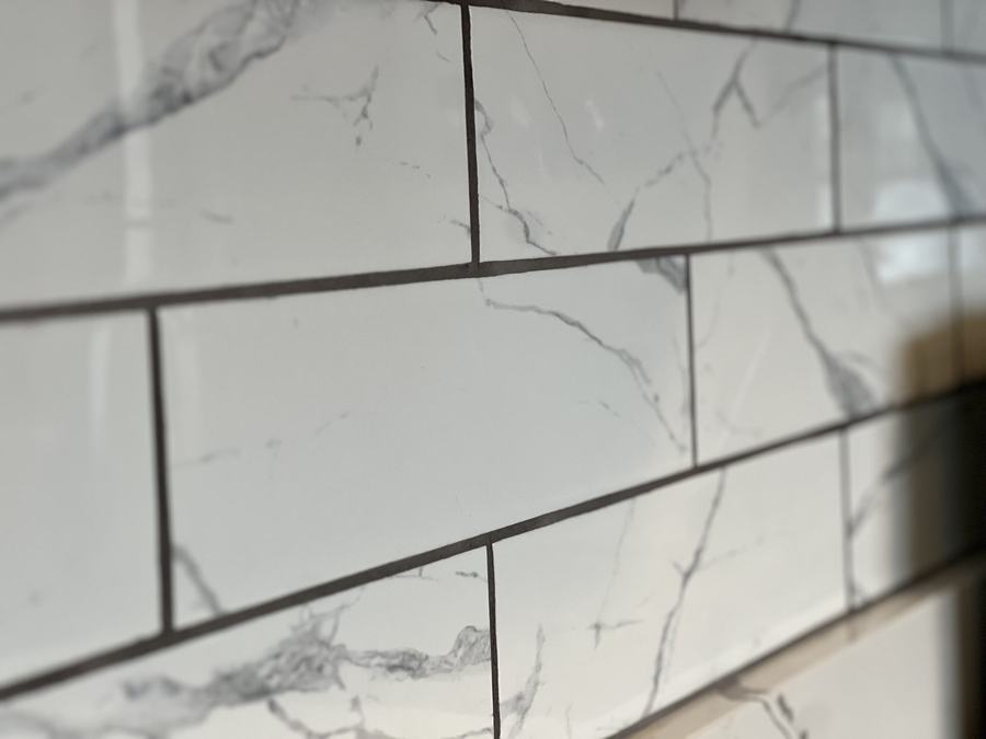 Finished a tile backsplash by High-5 Renovations